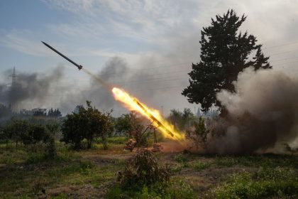 Syrian army forces fire a missile against fighters linked to Syria's ousted leader Bashar al-Assad on March 7.