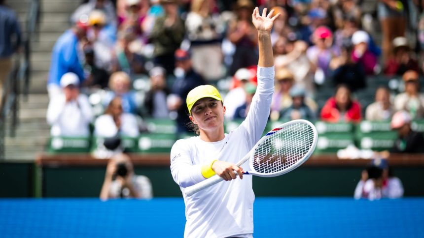 Iga Świątek celebrates defeating Karolína Muchová in the fourth round of the BNP Paribas Open at Indian Wells on March 11.