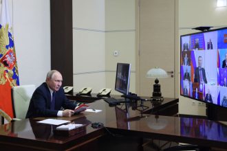 Russia's President Vladimir Putin chairs a security council meeting via videoconference at the Novo-Ogaryovo state residence outside Moscow on Friday.