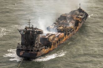 Smoke rises from the Solong cargo ship in the North Sea on Tuesday.