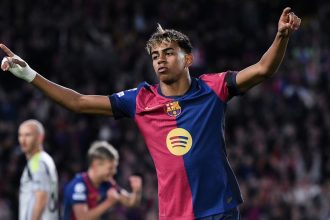 Lamine Yamal celebrates during Barcelona's 3-1 win against Benfica on Tuesday.