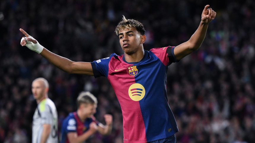 Lamine Yamal celebrates during Barcelona's 3-1 win against Benfica on Tuesday.