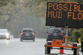 A sign reading 'Possible Mud Flow' on March 12, 2025, in Sierra Madre, California.