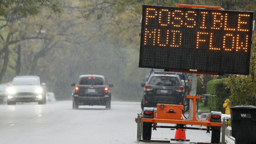 A sign reading 'Possible Mud Flow' on March 12, 2025, in Sierra Madre, California.