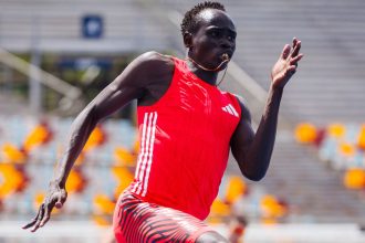 Gout Gout competes in the men's under-20 200m heats at the Queensland State Championships in Brisbane.