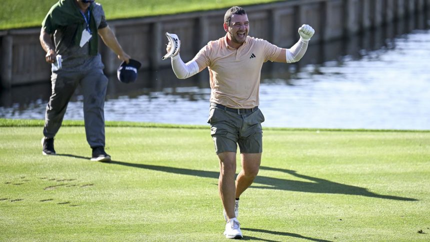 A soaked Tosti celebrates his hole-in-one at TPC Sawgrass.