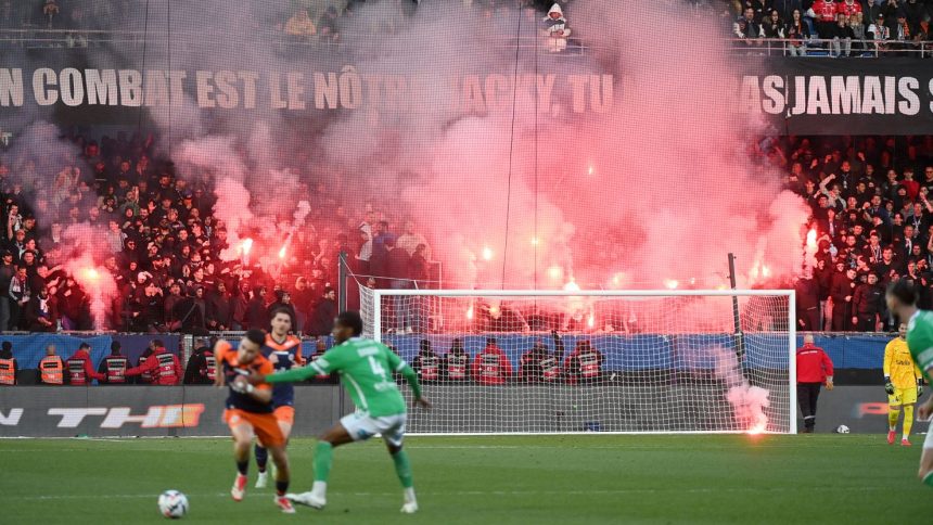 Montpellier supporters light flares during the match against Saint-Étienne at the Stade de la Mosson on Sunday.