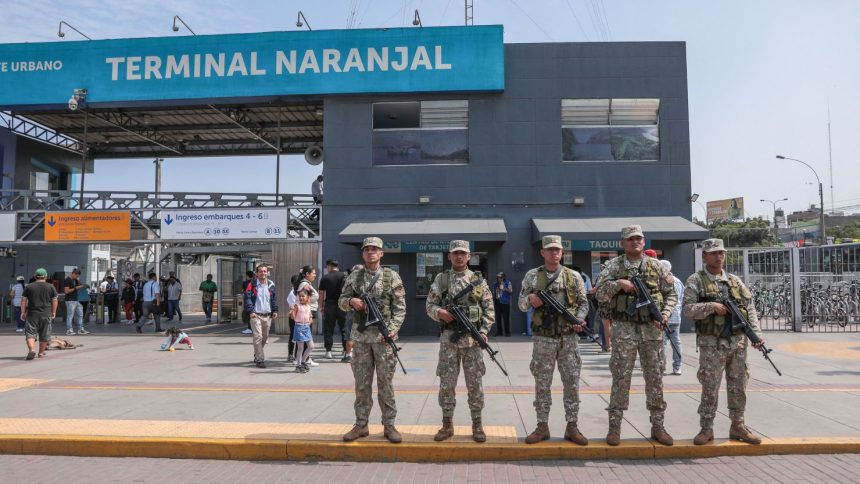 Military forces stand guard outside the Naranjal Metropolitano transport station in Lima on March 18, 2025, a day after Peru declared a month-long state of emergency in the capital after a wave of killings linked to extortion.