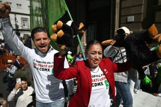 Anti-bullfighting activists celebrate outside Mexico City's congress after an initiative to overhaul bullfighting was approved.