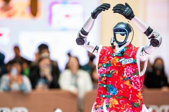 A humanoid robot from Chinese firm Unitree dances during an AI technology show in Hong Kong on March 15, 2025.