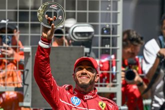 Lewis Hamilton celebrates winning the sprint race at the Chinese Grand Prix, his first victory at Ferrari.