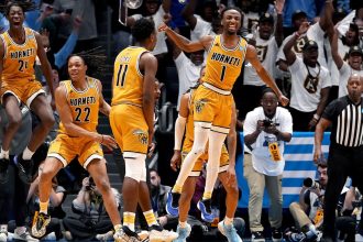 Alabama State guard Amarr Knox celebrates with teammates after making the would-be game winning layup against St. Francis (PA) in the First Four game.