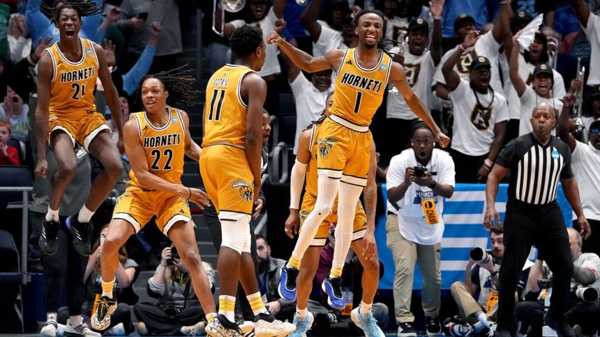 Alabama State guard Amarr Knox celebrates with teammates after making the would-be game winning layup against St. Francis (PA) in the First Four game.