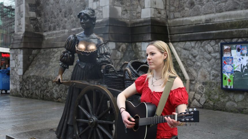 Busker Tilly Cripwell wants passersby to keep their mitts off Molly Malone.