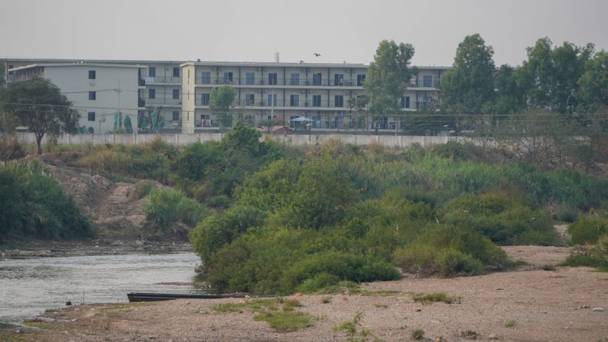 Scam compound buildings in Myanmar can be seen in this picture taken from Mae Sot, Thailand, in February 2025.