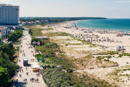 The Baltic sea coastline at Rostock. The naturist sections of the beach start beyond the large Hotel Neptun building.