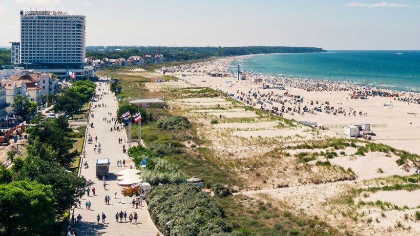 The Baltic sea coastline at Rostock. The naturist sections of the beach start beyond the large Hotel Neptun building.