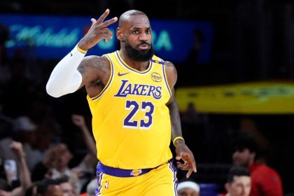 Los Angeles Lakers forward LeBron James gestures after making a 3-point basket to go over the 50,000 career point mark against the New Orleans Pelicans on Tuesday.