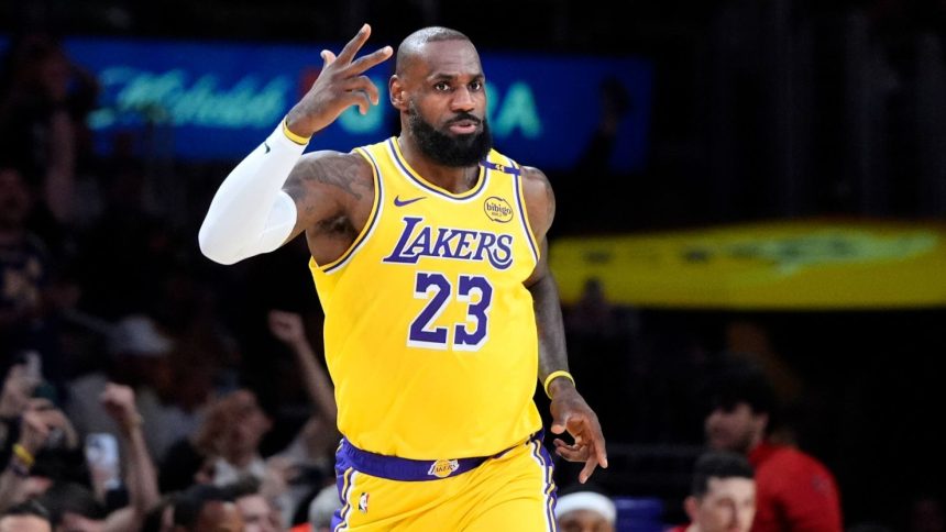 Los Angeles Lakers forward LeBron James gestures after making a 3-point basket to go over the 50,000 career point mark against the New Orleans Pelicans on Tuesday.