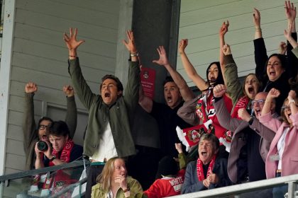 Wrexham co-owners Ryan Reynolds (left) and Rob McElhenney celebrate after Wrexham scored their second goal Saturday.