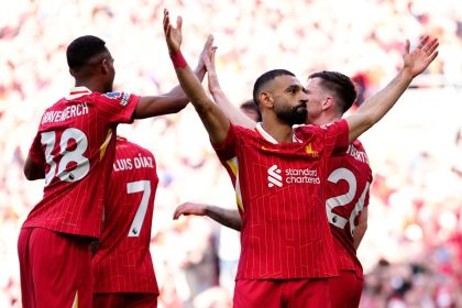Mohamed Salah celebrates scoring in Liverpool's Premier League-confirming win over Tottenham Hotspur on April 27.
