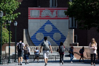 Students walk between classes in the Wynn Commons on the campus of the University of Pennsylvania in Philadelphia, Pennsylvania.