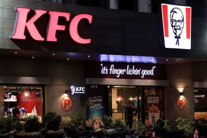 A security guard stands at the entrance of a Kentucky Fried Chicken outlet in Karachi, Pakistan, on April 16, 2025.