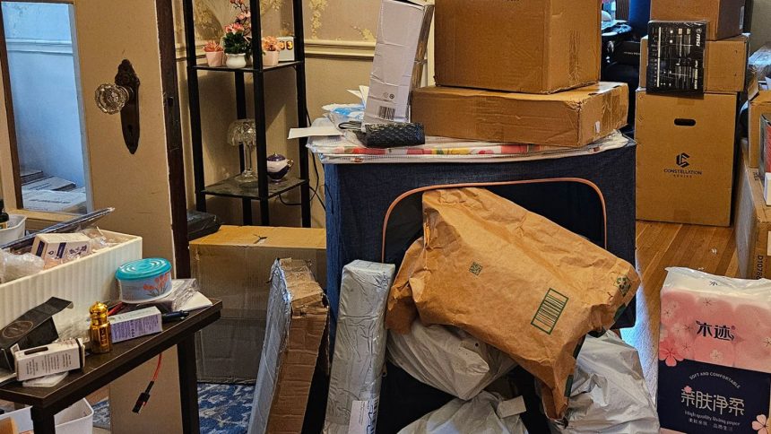Packages seen in the home of Phillip Dampier, a 57-year-old who orders from Temu and other Chinese e-commerce sites.