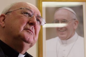 FILE - Cardinal Kevin Farrell, head of the Vatican's family and laity office, talks during an interview with The Associated Press in office in Rome, Tuesday, July 31, 2018. (AP Photo/Paolo Santalucia, file)