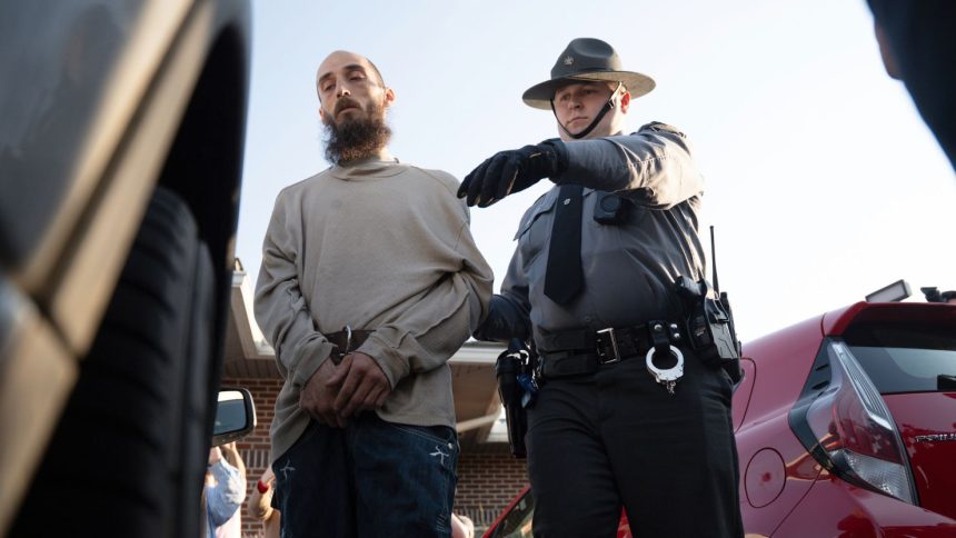 Cody Balmer is escorted from court after an arraignment hearing on Monday in Harrisburg, Pennsylvania.