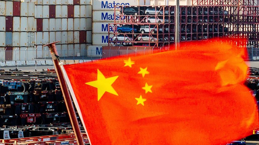 A Chinese flag flies from a ship at the Port of Oakland in Oakland, California, on April 15, 2025.