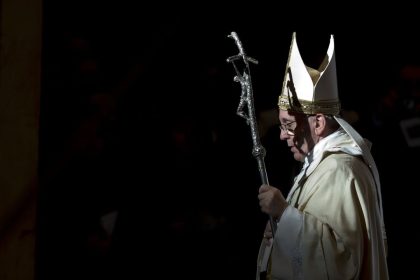 Pope Francis holds the pastoral staff as he leaves after celebrating a Mass in St. Peter's Basilica, at the Vatican, to mark Epiphany, Monday, Jan. 6, 2014.