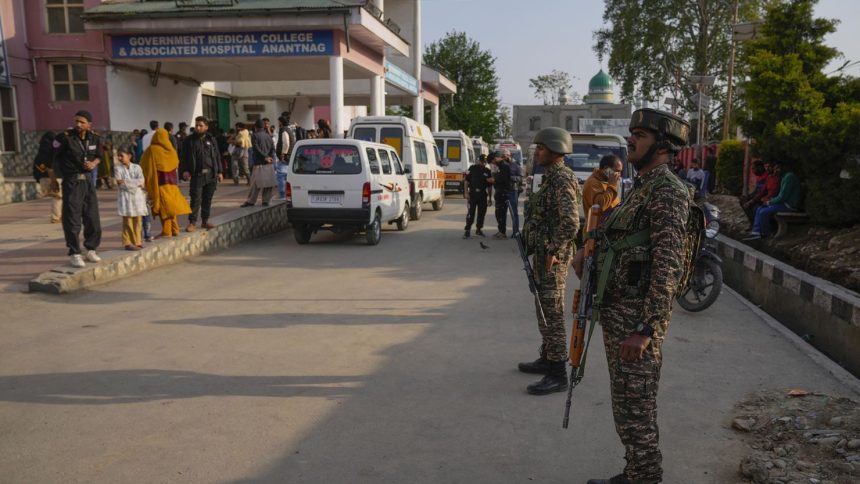 Indian security officers stand guard at a hospital in Jammu and Kashmir's Anantnag's district after assailants fired at tourists in the tourist destination of Pahalgam on Tuesday.