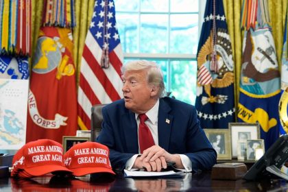 President Donald Trump speaks with reporters in the Oval Office of the White House on Wednesday.