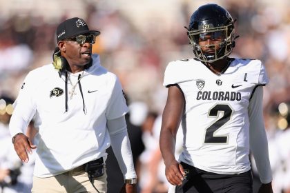 Shedeur Sanders along with his coach and father, Pro Football Hall of Famer Deion Sanders.