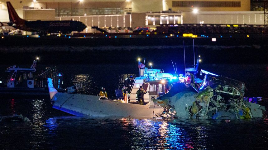 Emergency response units assess airplane wreckage in the Potomac River near Ronald Reagan Washington Airport on January 30, 2025 in Arlington, Virginia.
