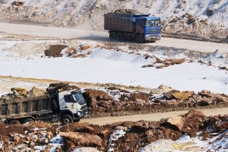 Earth and minerals are loaded onto trucks at an open-pit mine near the frontline on February 26, 2025 in Donetsk Region, Ukraine.