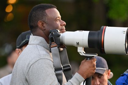 Ken Griffey Jr., American baseball player, stands with a camera near the first tee box during the first round of the Masters Tournament at Augusta National Golf Club on Thursday in Augusta, Georgia.
