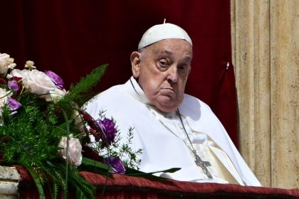 Pope Francis stands on the main balcony of St. Peter's basilica for the Urbi et Orbi message and blessing to the city and the world as part of Easter celebrations, at St Peter's square in the Vatican on April 20, 2025. (Photo by Tiziana FABI / AFP) (Photo by TIZIANA FABI/AFP via Getty Images)