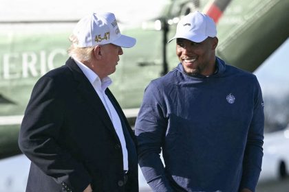 US president Donald Trump walks with Philadelphia Eagles running back Saquon Barkley at Morristown, New Jersey.