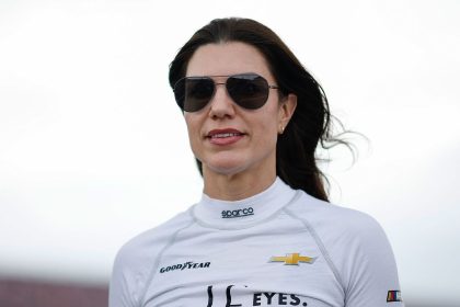 Katherine Legge walks the grid during qualifying for the NASCAR Xfinity Series Ag-Pro 300 at Talladega Superspeedway in Talladega, Alabama, on Friday.