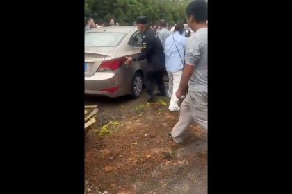 The scene after a car plowed into a crowd of people outside a school in Jinhua in the province of Zhejiang, China, on Tuesday.