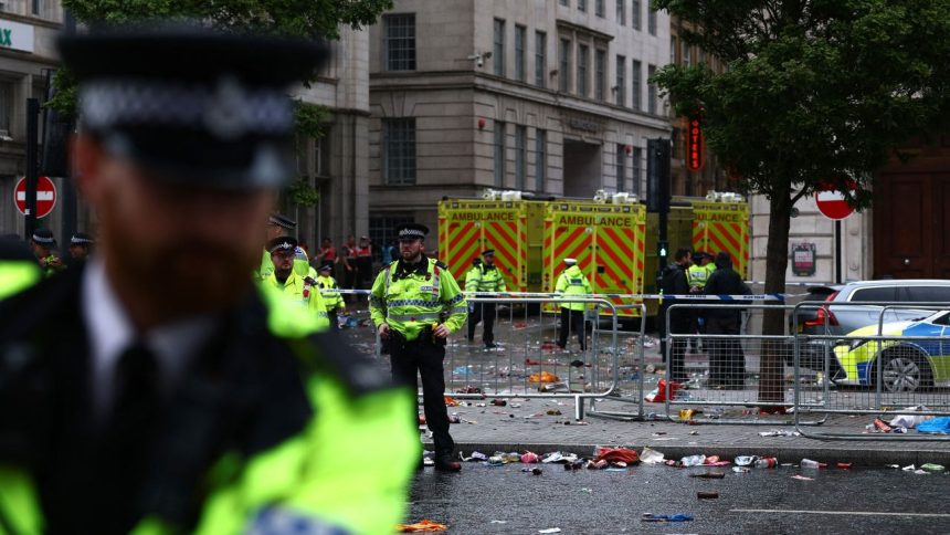 Soccer Football - Premier League - Liverpool Victory Parade - Liverpool, Britain - May 26, 2025
Emergency services at an incident involving a car and supporters during the Victory parade Action Images via Reuters/Lee Smith