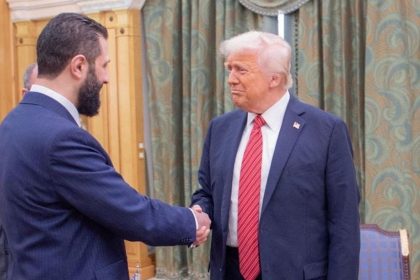 Syrian President Ahmed al-Sharaa shakes hands with US President Donald Trump in Riyadh, Saudi Arabia on May 14, 2025.