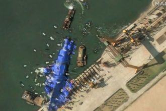 A satellite image shows what appear to be white balloons floating above the stranded North Korean warship that was damaged after a failed launch, in Chongjin, North Korea, on May 24, 2025.