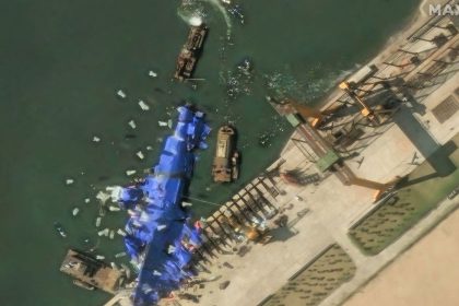 A satellite image shows what appear to be white balloons floating above the stranded North Korean warship that was damaged after a failed launch, in Chongjin, North Korea, on May 24, 2025.