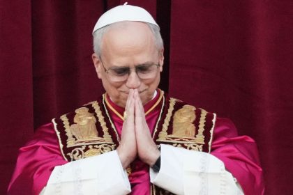 Cardinal Robert Prevost appears on the central loggia of St. Peter's Basilica after being chosen the 267th pontiff of the Roman Catholic Church, choosing the name of Pope Leo XIV, at the Vatican, Thursday, May 8, 2025. (AP Photo/Alessandra Tarantino)