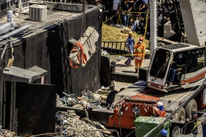 Personnel from civil defense and firefighters work at the Jet Set nightclub following the collapse of its roof in Santo Domingo on April 8, 2025.