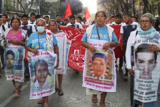 Students follow relatives of the 43 missing students of Ayotzinapa Rural Teachers' College and members of collectives of relatives of missing persons during the Ayotzinapa's monthly march to demand justice in Mexico City, Mexico.