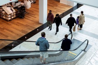 Shoppers walk through the King of Prussia Mall in Pennsylvania.